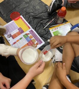 children measuring sugar